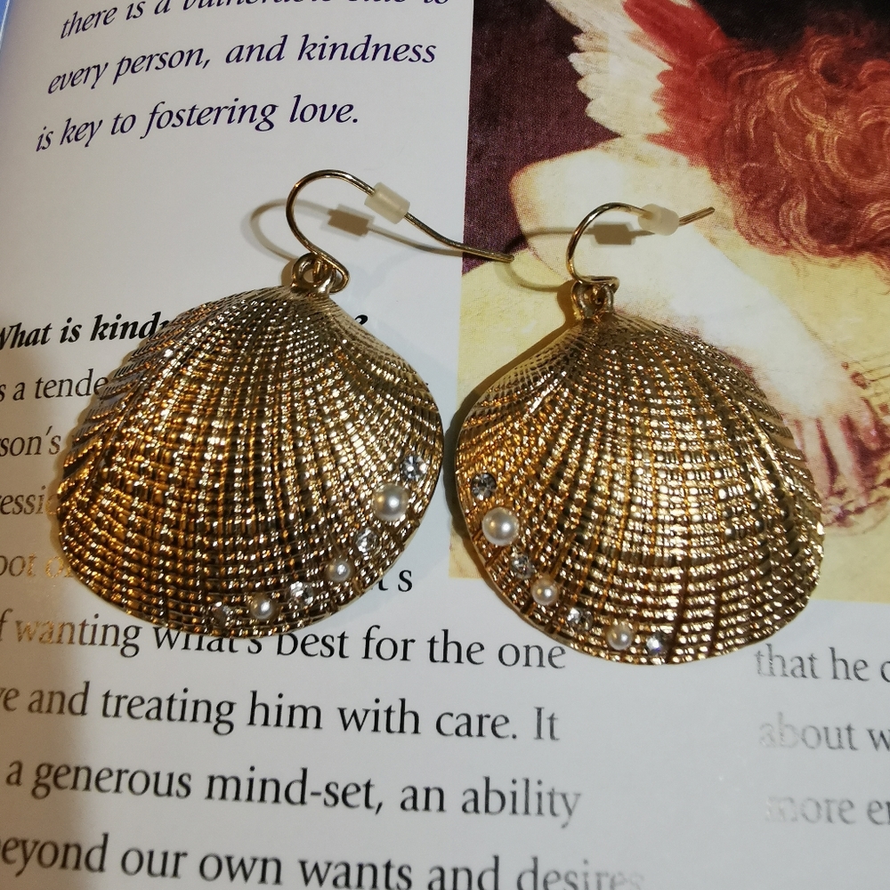 Scallop earrings with a blister of tiny pearls and white gemstones.